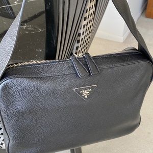 Prada camera bag in perfect condition purchased at Saks Fifth Avenue.